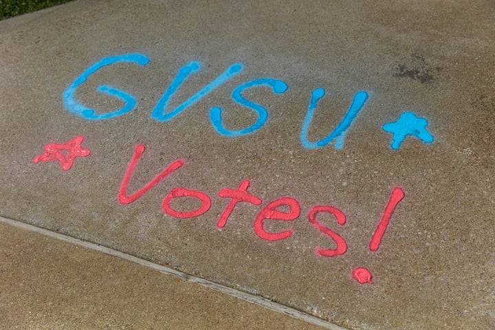 GVSU Votes written on sidewalk